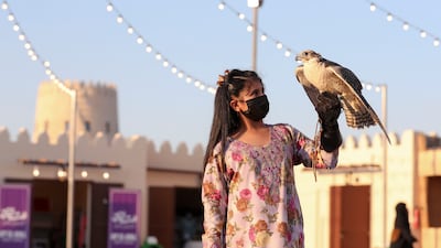 Alia Obaid, 8, from Madinat Zayed has a love for falcons and trains with them often at Al Dhafra Festival.