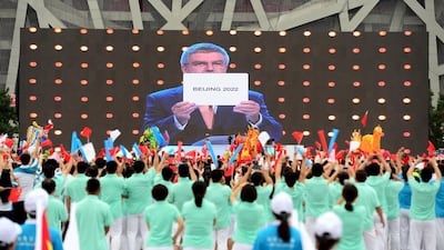 People cheer as they watch on a screen the IOC announcing Beijing as the winner city for the 2022 Winter Olympics bid. Stringer / Reuters