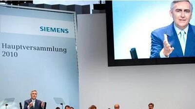 CEO of German industrial conglomerate Siemens Peter Loescher is seen on a screen during his speech at the company's annual shareholders meeting in Munich January 26, 2010. Siemens posted on Tuesday first-quarter operating profit that grew by 11 percent, far exceeding the estimates of analysts, who had expected a decline. REUTERS/Siemens Pressebild/Handout (GERMANY) FOR EDITORIAL USE ONLY. NOT FOR SALE FOR MARKETING OR ADVERTISING CAMPAIGNS (BUSINESS) *** Local Caption *** REH15_SIEMENS-_0126_11.JPG *** Local Caption *** REH15_SIEMENS-_0126_11.JPG