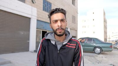 Qusay Tashtoush, software engineering graduate, stands outside the shisha factory where he packages tobacco.Amy McConaghy / The National