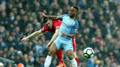 James Milner, left, and Raheem Sterling, right, moved in opposite directions in 2015. Nigel Roddis / EPA