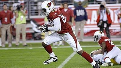 The Cardinals linebacker Karlos Dansby returns a fumble by the Packers' quarterback Aaron Rodgers for a touchdown in overtime.