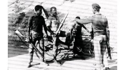 A Pakistani sergeant, right, directs two members of the militia to defensive positions on the outskirts of Dacca, East Pakistan's capital city, on Dec. 12, 1971. A battle with approaching Indian troops was expected within a day or so after Pakistan's President Agha Mohammad Yahya Khan ordered the Pakistanis in Dacca to fight to the last.