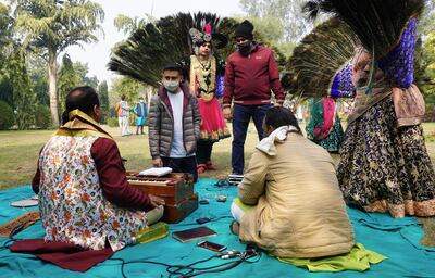 Abhinav Agrawal with artists during a microphone set up.