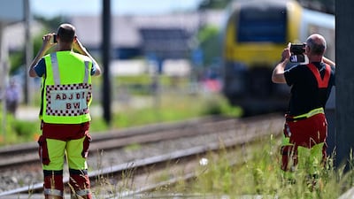 Emergency services survey the accident scene. AFP