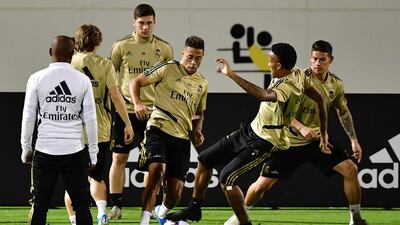 Real Madrid's Eder Militao and Mariano Diaz battle for posession. AFP
