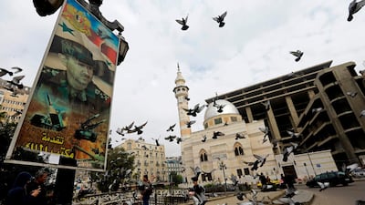 Pigeons fly around Marja Square in the centre of Damascus. Louai Beshara / AFP Photo