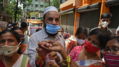 Women tie rakhis while celebrating in Kolkata. AFP