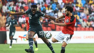 Egypt's Mohamed Salah battles for possession with Nigeria defender Kenneth Omeruo. AFP