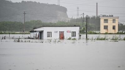 Floodwaters surround a building in Yuyao near the city of Ningbo in eastern China's Zhejiang province.