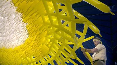 The balloon artist Jason Hackenwerth weaving Corona for Abu Dhabi Science Festival. Silvia Razgova / The National