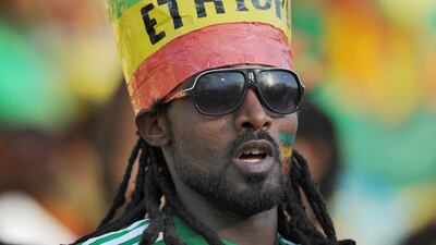 An Ethiopia fan in a distinctive hat watches his team’s 2013 African Cup of Nations Group C match against Nigeria, in Rustenburg, South Africa.
