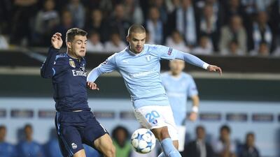 Real Madrid's Mateo Kovacic fights for the ball with Malmo's Vladimir Rodic during their Champions League contest on Wednesday night. Andreas Hillergren / Reuters / TT News Agency