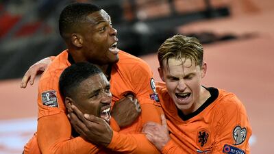 Netherlands' forward Steven Bergwijn celebrates with teammates after scoring his team's first goal against Norway. AFP