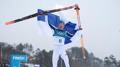 livo Niskanen of Finland celebrates winning the gold medal at the 2018 Winter Olympic Games. Matthias Hangst / Getty Images