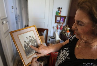 Lebanese Armenian Vany Bandikian shows a family picture in her house. Some of the areas worst-hit by the blast are home to the city's century-old 140,000-strong Armenian community. AFP
