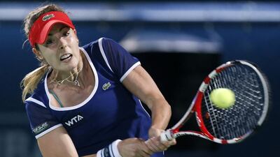 Alize Cornet returns the ball to Venus Williams during their women's singles final match at the WTA Dubai Tennis Championships on February 22, 2014. Ahmed Jadallah / Reuters