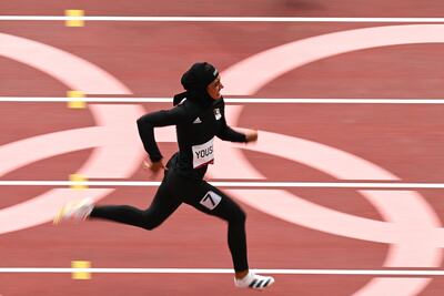 Afghanistan's Kimia Yousofi competes in the women's 100m heats during the Tokyo 2020 Olympic Games. AFP