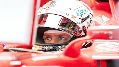 Ferrari's Sebastian Vettel prepares for first practice ahead of the Abu Dhabi Grand Prix at Yas Marina Circuit. Christopher Pike / The National