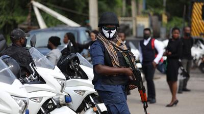 A Nigeria State Secret Police officer is seen outside a Federal High Court. Photo: AFP