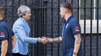 British prime minister Theresa May shakes hands with England opener Jason Roy. AFP