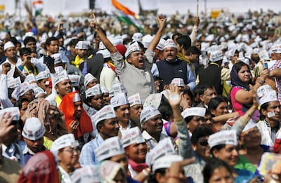 A supporter of the Aam Aadmi Party cheers after its chief Arvind Kejriwal took an oath as the new chief minister of Delhi during a swearing-in ceremony at Ramlila ground in New Delhi in February 2015. Reuters