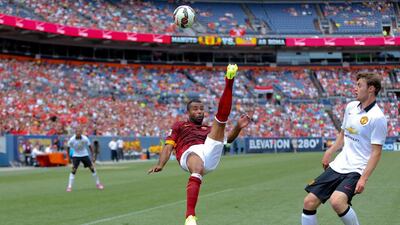 Ashley Cole, left, of AS Roma kicks the ball over his head near William Keane, right, of Manchester United during their match on Saturday at the International Champions Cup. Justin Edmonds / Getty Images/ AFP