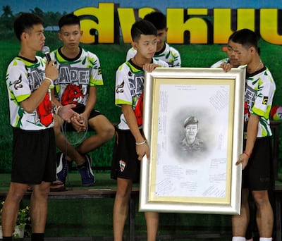 Members of the Wild Boar football team pay tribute to Thai navy diver Saman Kunan, who died while taking part in an operation to rescue them after they were trapped in the Tham Luang Nang Non caves. EPA