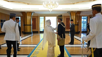 Malaysia's new king and queen. Malaysia Information Ministry via AP