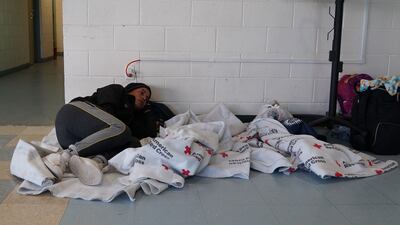 Ender Gonzales, a migrant from Venezuela, rests in a shelter in El Paso, Texas. Willy Lowry / The National