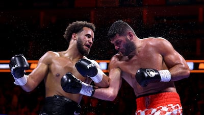 Moses Itauma, left, and Filip Hrgovic exchange blows in London. Reuters