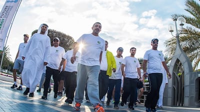 The Minister of Foreign Affairs, Sheikh Abdullah bin Zayed, and his employees and their families take part in an organised walk to encourage healthy lifestyles along the Abu Dhabi corniche.