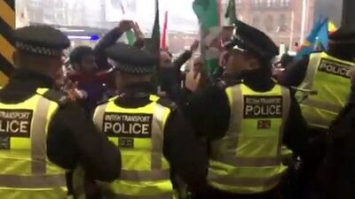 People attend an Afrin protest at King's Cross station in London on March 11 in this picture obtained from social media. Ashok Kumar / Reuters