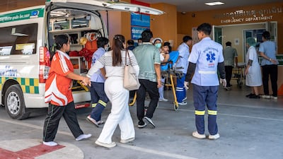 One of the injured is taken for treatment at Bang Yai hospital in Nonthaburi province. AFP