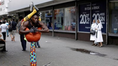 An African immigrant stranded in Costa Rica perfoms on Central Avenue in San Jose, Costa Rica. Juan Carlos Ulate / Reuters