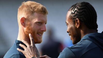 England's Ben Stokes, left, and Jofra Archer share a joke during a nets session. AFP