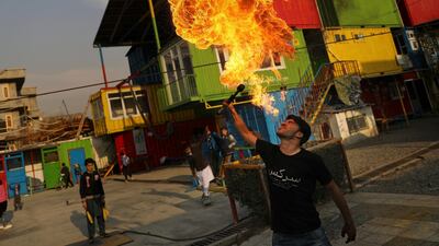 An Afghan boy of the Afghan Mobile Mini Circus for Children practises fire breathing techniques at its centre in Kabul, Afghanistan. AP Photo