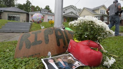 A small memorial sits in front of the boyhood home of Muhammad Ali, Saturday, June 4, 2016 in Louisville Kentucky. Timothy Easley / AP Photo