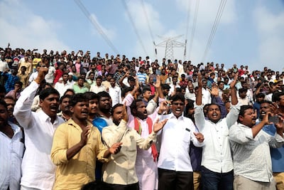 A crowd at the scene of the shooting chant songs praising police in Shadnagar. AP Photo