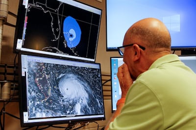 Dr Lixion Avila, senior hurricane specialist, prepares a forecast at the National Hurricane Centre ahead of the arrival of Hurricane Dorian in Miami, Florida, US September 1, 2019. REUTERS/Joe Skipper