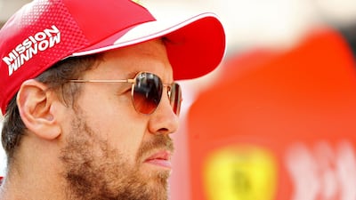 Sebastian Vettel of Germany and Ferrari in the Paddock before final practice on Saturday. Getty