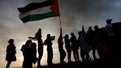 Israeli activists protest in solidarity with Palestinians during the Friday protest at the Israeli Gaza border near Nahal Oz, facing the Gaza Neighborhood of Shajaiya. Israeli army deployed more soldiers along the border. EPA