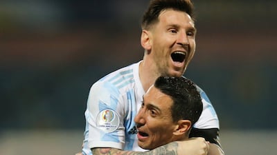 Argentina's Lionel Messi celebrates scoring their third goal against Ecuador with Angel Di Maria. Reuters