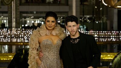 Indian actress Priyanka Chopra and American singer, songwriter and actor Nick Jonas stand for photographs during the inaugural function of Nita Mukesh Ambani Cultural Centre in Mumbai, India, Friday, March 31, 2023. (AP Photo / Rajanish Kakade)