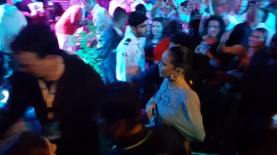 Rihanna left her seating area to mingle with the crowd. Saeed Saeed / The National