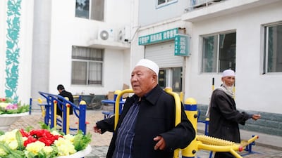 Three Chinese Muslim men await evening prayer. Sarah Dea / The National