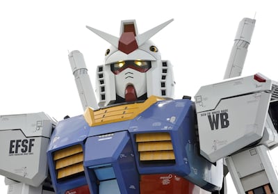 A previous model of the Gundam flashes its eyes at a press preview at a Tokyo park in July 2009. AFP