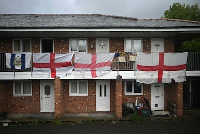 St George's Cross flags in Ashton-in-Makerfield. AFP