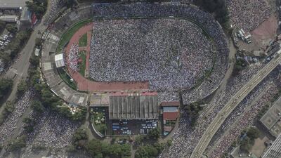 Worshippers listen to the Eid Al Fitr morning prayer sermon at a football stadium in Addis Ababa, Ethiopia. AFP