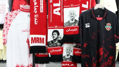 Scarves of Iranian footballer Sardar Azmoun hang in the club shop.
